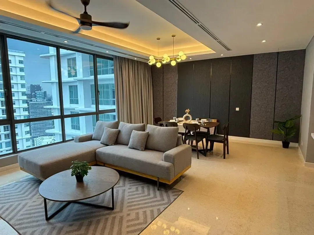 A finished D’ Rapport living and dining room with a city view